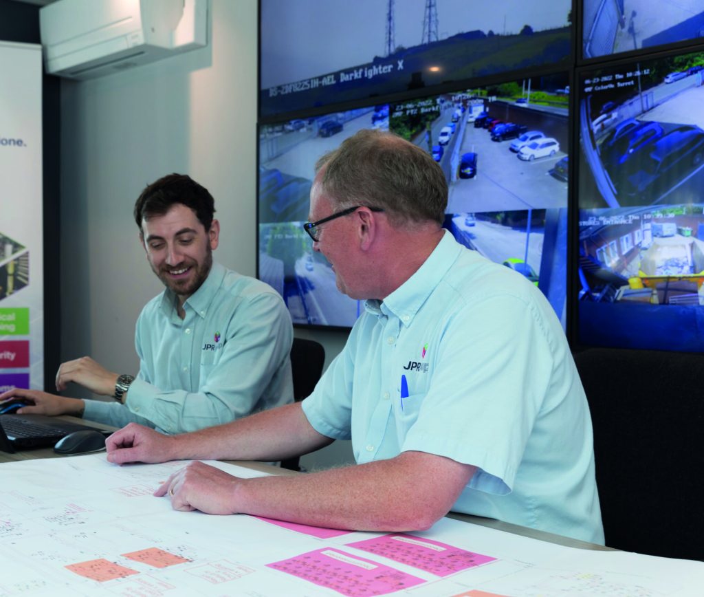 Twp colleagues talking in a meeting discussing projects